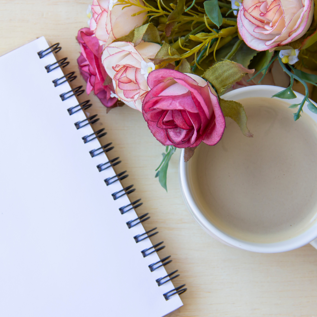 journal, flowers and coffee